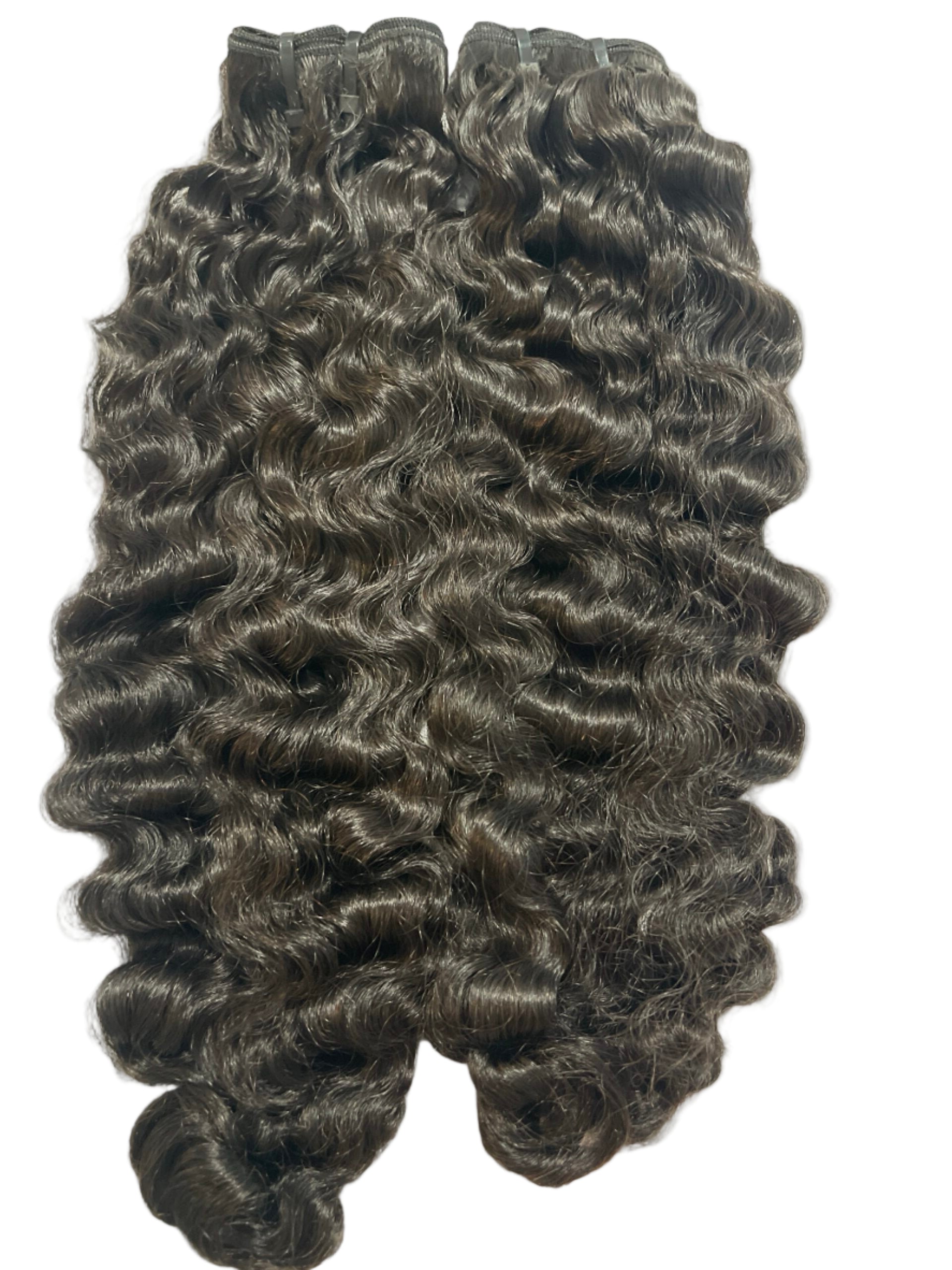 Bunch of curly hair extensions on a white background